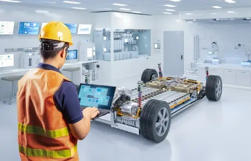 Technician works with a car battery cells module in laboratory